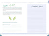 The 100% Happiness journal page by Schiffer Publishing, Ltd. features "Cycle" on the left with green leaf décor, life cycle prompts, and space for personal growth. The right offers a blue-lined Personal Notes section, all within a light floral border.