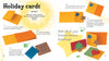 DIY holiday card craft with Christmas from Schiffer Publishing, Ltd.—use yellow/orange cardstock, brown/blue cardboard, and cardboard stars to create cards featuring colorful stars, a tree, and the message "Wish all of your Friends Seasons Greetings!.