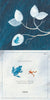 An illustration from Schiffer Publishing, Ltd.'s "Like a Tree" shows a blue frog on white leaves in the rain, exploring symmetries in nature and noting that larger frogs make lower sounds while smaller frogs have higher calls.