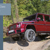 A red Mercedes-Benz G-Class from Schiffer Publishing, Ltd. navigates an off-road dirt path amid lush greenery, showcasing its rugged all-wheel-drive features. On the left, a gray panel reads: 2. The G-Class Models.