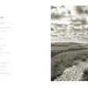An open book, "Martha's Vineyard" by Schiffer Publishing, Ltd., displays the poem "The Sun" on the left and a sepia Michael Kahn photo of a sandy path winding through grassy dunes under a sky with scattered clouds on the right.