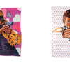 Loaded by Schiffer Publishing, Ltd. features two vibrant quilts inspired by contemporary art: one depicts a long-haired woman in animal print aiming a gun, while the other shows a suited man firing, both against bold patterned backgrounds.