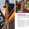 A historic red brick church with a clock overlooks a vibrant street—a scene from Schiffer Publishing, Ltd.’s “Secret Cities of Europe,” where cobblestone lanes wind past vine-covered red brick houses with blooming flowers.