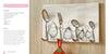 The Whimsical Wire by Schiffer Publishing, Ltd. is a decorative board featuring whimsical family figures made from beginner wire crafts and kitchen utensils, each with a spoon or fork head and book-page body, arranged as unique hooks.