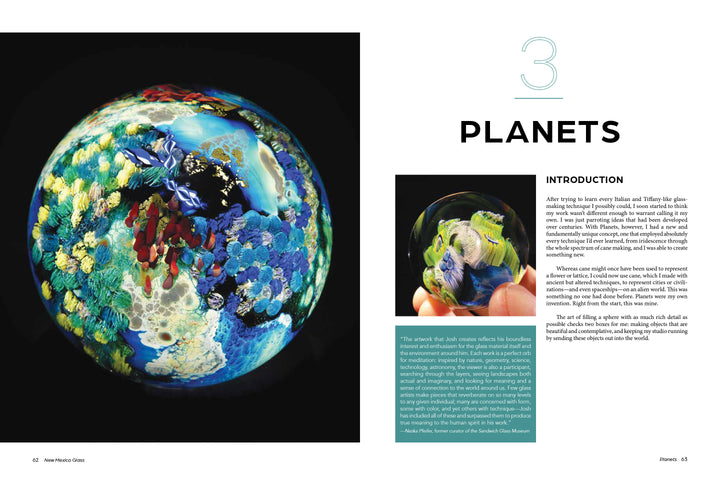 A vibrant Josh Simpson glass sculpture with coral-like patterns sits on a dark background. Beside it, a page labeled “3 PLANETS” from Schiffer Publishing, Ltd. shows text and hands gently holding this stunning glass art.