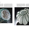 Two sculptural glass baskets evoking Josh Simpson's artistry—one frosted with green wire and copper mesh, the other ribbed white with green cords—are showcased. Featured in "Josh Simpson" by Schiffer Publishing, Ltd.