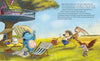 In “The Grumbletroll . . . Wants to Be First!” by Schiffer Publishing, Ltd., a blue Grumbletroll lounges with friends on a picnic in colorful nature beside a treehouse. Text appears on the right, capturing a scene of cheerful sportsmanship.