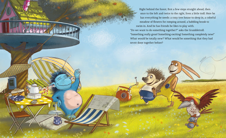 In “The Grumbletroll . . . Wants to Be First!” by Schiffer Publishing, Ltd., a blue Grumbletroll lounges with friends on a picnic in colorful nature beside a treehouse. Text appears on the right, capturing a scene of cheerful sportsmanship.