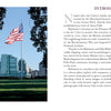 A mostly clear sky with a few clouds frames an American flag on a tall pole, waving before modern buildings, grassy areas, and trees—a classic scene from "Baltimore" by Schiffer Publishing, Ltd.