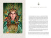 A woman in a green robe and crown of branches stands amid birds and butterflies, holding a golden pentacle. With serene leafy art, "Enchanting Creativity" by Schiffer Publishing, Ltd. inspires journaling; text appears on the right page.