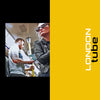 A man and woman ride the London Tube—left: inside a subway car; right: yellow panel with "LONDON tube" text. METRO / New York / London / Paris by Schiffer Publishing, Ltd. captures subway life and urban moments in major cities.
