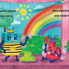 A vibrant stage scene with quirky characters—a green alien, a floral bee, a springy red block, and a sunflower person—unfolds under a sunny rainbow backdrop. “Big P Takes a Fall (and That’s Not All)” by Schiffer Publishing, Ltd. is featured.