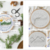 A flat lay showcases Sunny Stitches by Schiffer Publishing, Ltd., featuring beginner embroidery supplies, a finished mountain scene hoop, skeins of floss, scissors, pinecones, fern leaves, and step-by-step project instructions on the right.