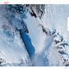 Aerial view from "The North" by Schiffer Publishing, Ltd.: Petermann Glacier in Greenland—an impressive frozen river amid snow-clad mountains and icy waters, with red text marking its location and coordinates.