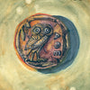 An oracle card from Between the Worlds by Schiffer Publishing, Ltd. depicts an ancient coin with an engraved owl, Greek letters, the number 25 in the top right, and "ANTIQUE COIN" at the bottom over watercolor textures.