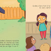 In a classroom, a young inventor unveils her large blue Rainbow Machine—covered with a fish-patterned cloth—and stands beside it, ready to present her invention from Schiffer Publishing's "Geraldine and the Rainbow Machine" to classmates and her teacher.
