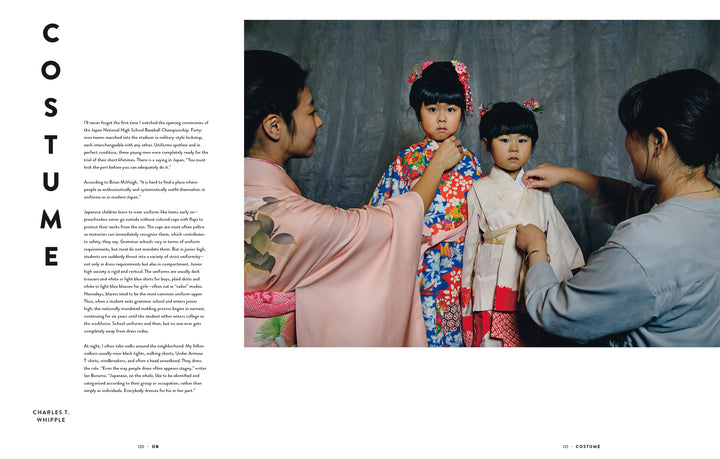 Two children in traditional Japanese clothing stand side by side as adults adjust their outfits—a fitting scene for "Japan" by Schiffer Publishing, Ltd., a photography book celebrating the beauty of Japanese culture.