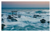 Experience serene Japanese beauty with "Japan" by Schiffer Publishing, Ltd.—a photography book featuring a torii gate rising from rocky outcrops amid gentle waves and a pastel sky, capturing the essence of dawn or dusk.
