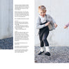 Three kids play happily outdoors in cozy, nature-inspired knitwear sets from "All-Year-Round Knitting for Little Sweethearts" by Schiffer Publishing, Ltd., featuring soft pink, white, and grey outfits—skirts and sweaters for girls, shorts and cardigan for the boy.