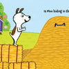 In Peek-A-Moo! by Schiffer Publishing, Ltd., an illustrated dog stands by hay bales, eyeing a haystack with cow ears poking out and a crowned cow in a doghouse. A fun farm animals board book, perfect as a toddler’s first read.