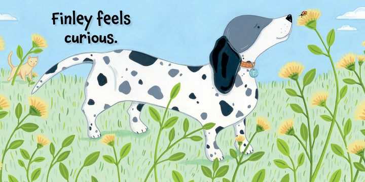 An illustrated spotted dog with a blue collar sniffs a yellow flower in a grassy field, while a cat watches. From Finley Feels by Schiffer Publishing, Ltd.—a children’s board book about emotions. Text reads, "Finley feels curious.