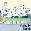 A Dalmatian lies bored on a striped mat, surrounded by toys and stuffing. The text features "Finley Feels" by Schiffer Publishing, Ltd.—an engaging children's board book exploring emotions. A toy cat appears in the background.