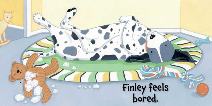 A Dalmatian lies bored on a striped mat, surrounded by toys and stuffing. The text features "Finley Feels" by Schiffer Publishing, Ltd.—an engaging children's board book exploring emotions. A toy cat appears in the background.