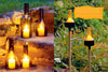 In Artfully Transforming Bottles & Plates by Schiffer Publishing, Ltd., cut wine bottles become elegant outdoor lanterns when placed on stone steps or garden stakes—perfect examples of creative glass bottle upcycling.