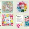 Make Your Memory by Schiffer Publishing, Ltd. features six scrapbook layouts with central photos and 3D paper flowers—ideal inspiration for scrapbooks or cards. Text boxes describe each layout on pastel backgrounds with vibrant blooms.